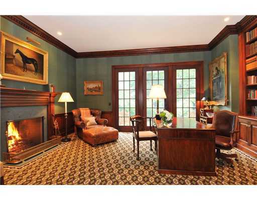 Undisclosed Address Greenwich, CT 06831 - Photo 15 of 20 a living room with furniture a fireplace and large windows