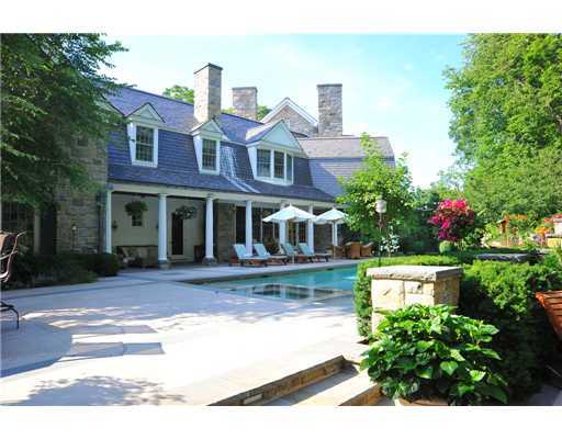 Undisclosed Address Greenwich, CT 06831 - Photo 4 of 20 a front view of a house with a yard