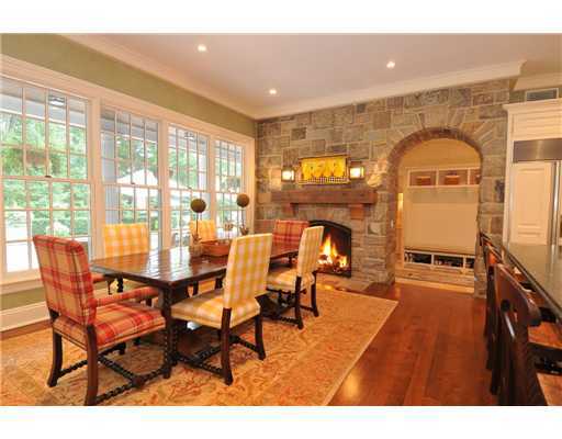 Undisclosed Address Greenwich, CT 06831 - Photo 7 of 20 a living room with furniture a fireplace and a floor to ceiling window