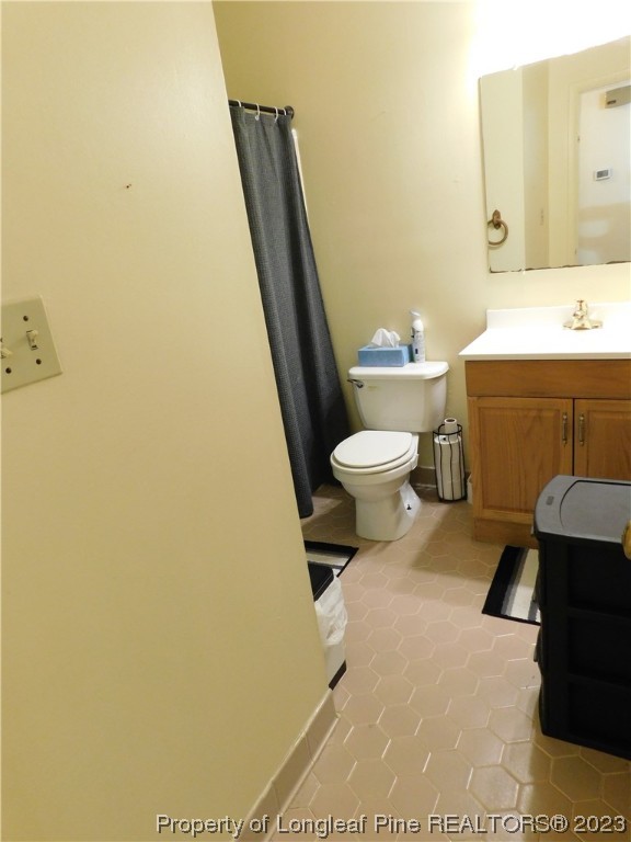 215 Duncan Road Spring Lake, NC 28390 - Photo 14 of 19 a bathroom with a toilet and a sink