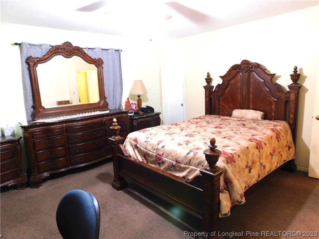 215 Duncan Road Spring Lake, NC 28390 - Photo 16 of 19 a bed sitting in a bedroom next to a window