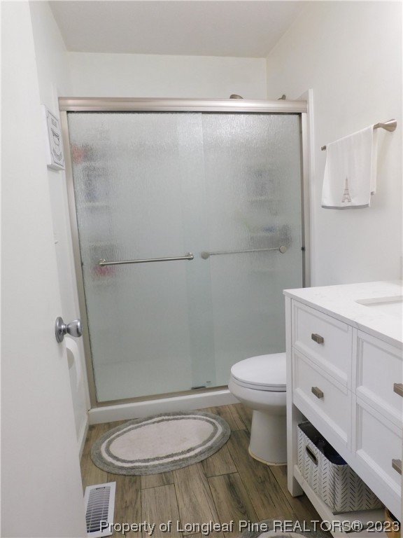 215 Duncan Road Spring Lake, NC 28390 - Photo 17 of 19 a bathroom with a toilet a sink and a shower