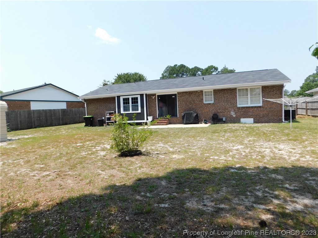 215 Duncan Road Spring Lake, NC 28390 - Photo 19 of 19 a front view of a house with a yard and outdoor seating