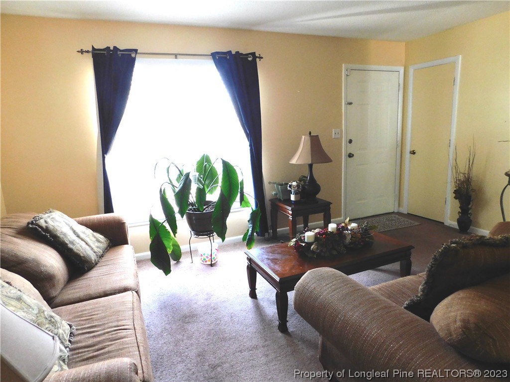 215 Duncan Road Spring Lake, NC 28390 - Photo 3 of 19 a living room with furniture and a window