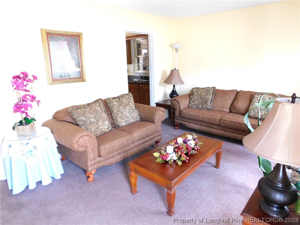 215 Duncan Road Spring Lake, NC 28390 - Photo 4 of 19 a living room with furniture and a couch