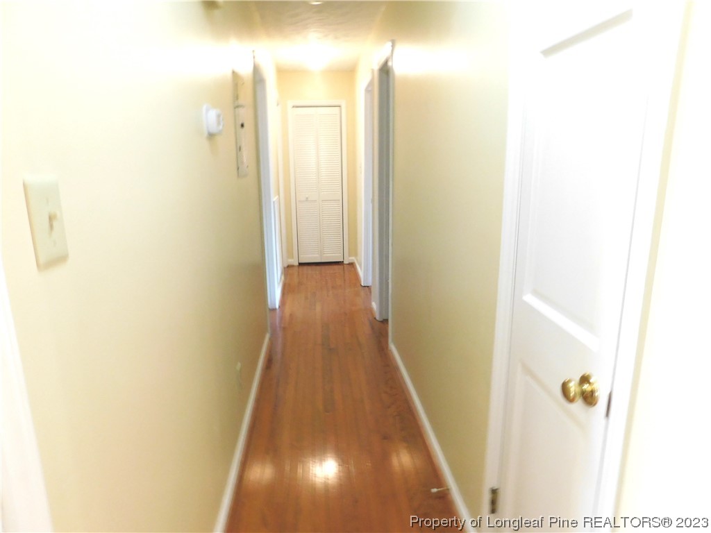 215 Duncan Road Spring Lake, NC 28390 - Photo 5 of 19 a view of a hallway with wooden floor