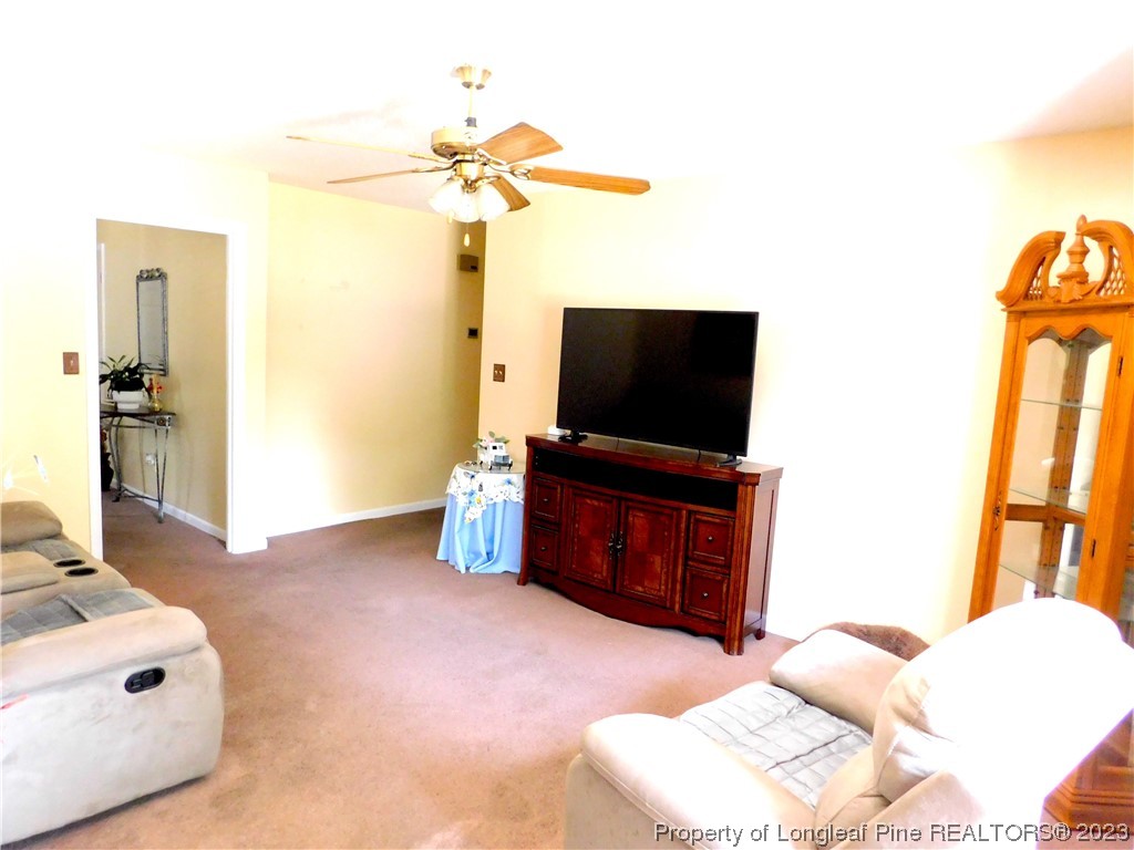 215 Duncan Road Spring Lake, NC 28390 - Photo 10 of 19 a living room with a flat screen tv furniture and a flat screen tv