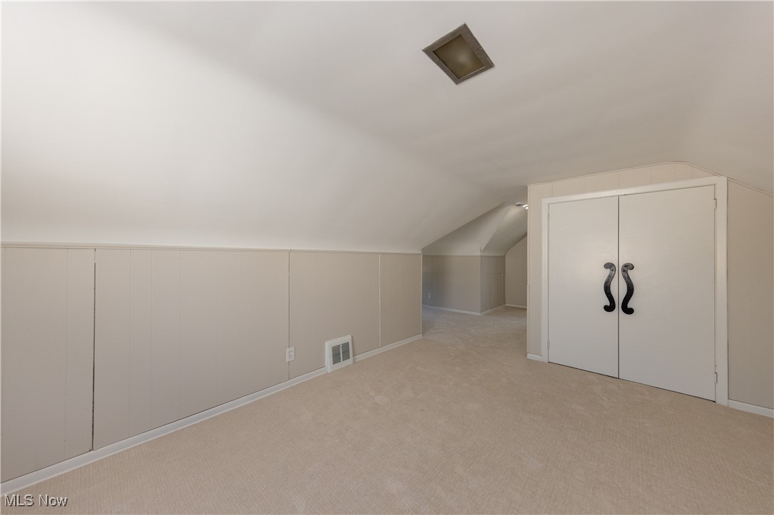 29103 Barjode Road Eastlake, OH 44095 - Photo 19 of 31 Additional living space featuring light carpet and lofted ceiling