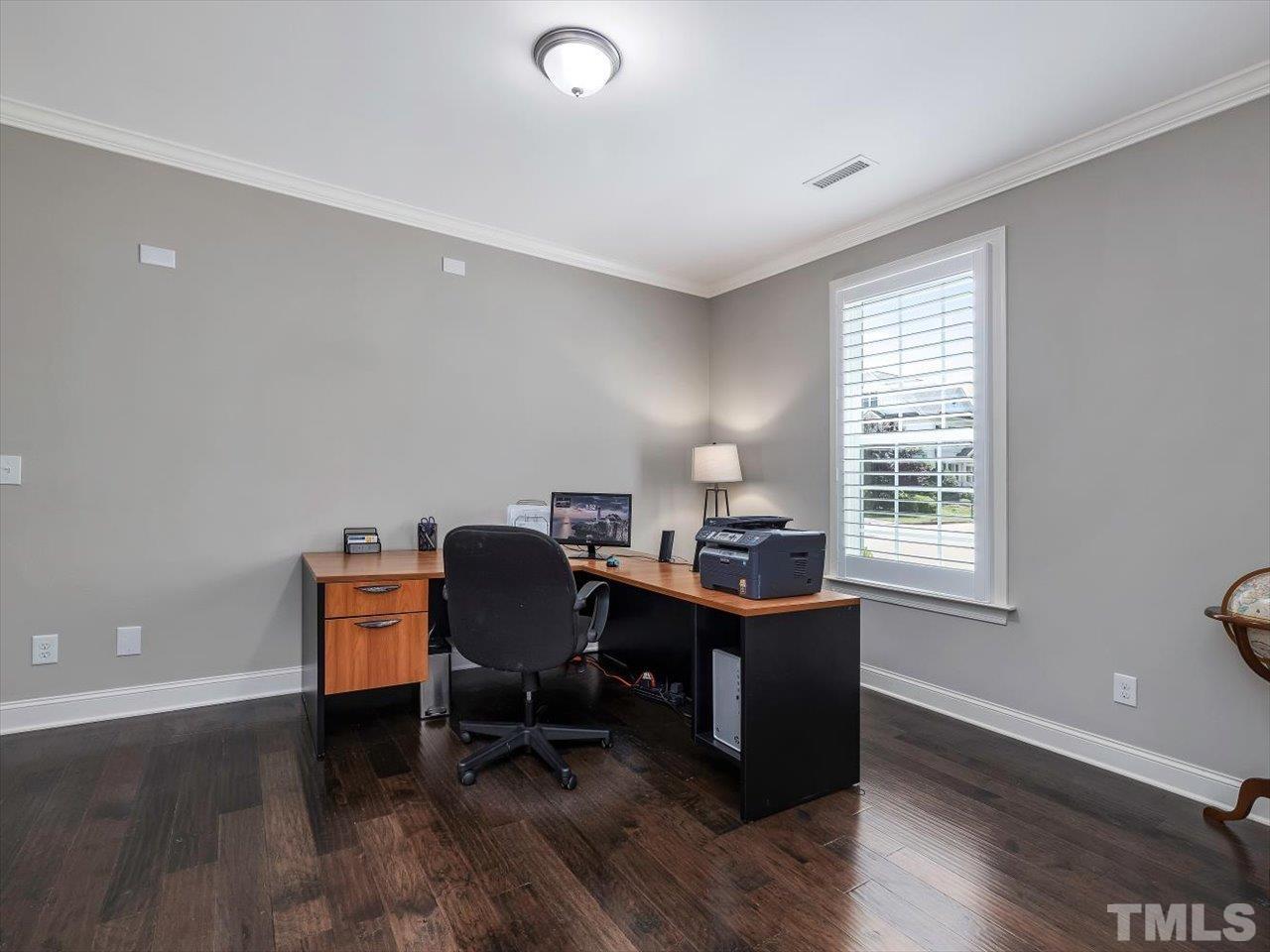 604 Chapanoke Road Raleigh, NC 27603 - Photo 12 of 30 a view of a workspace with furniture and a window