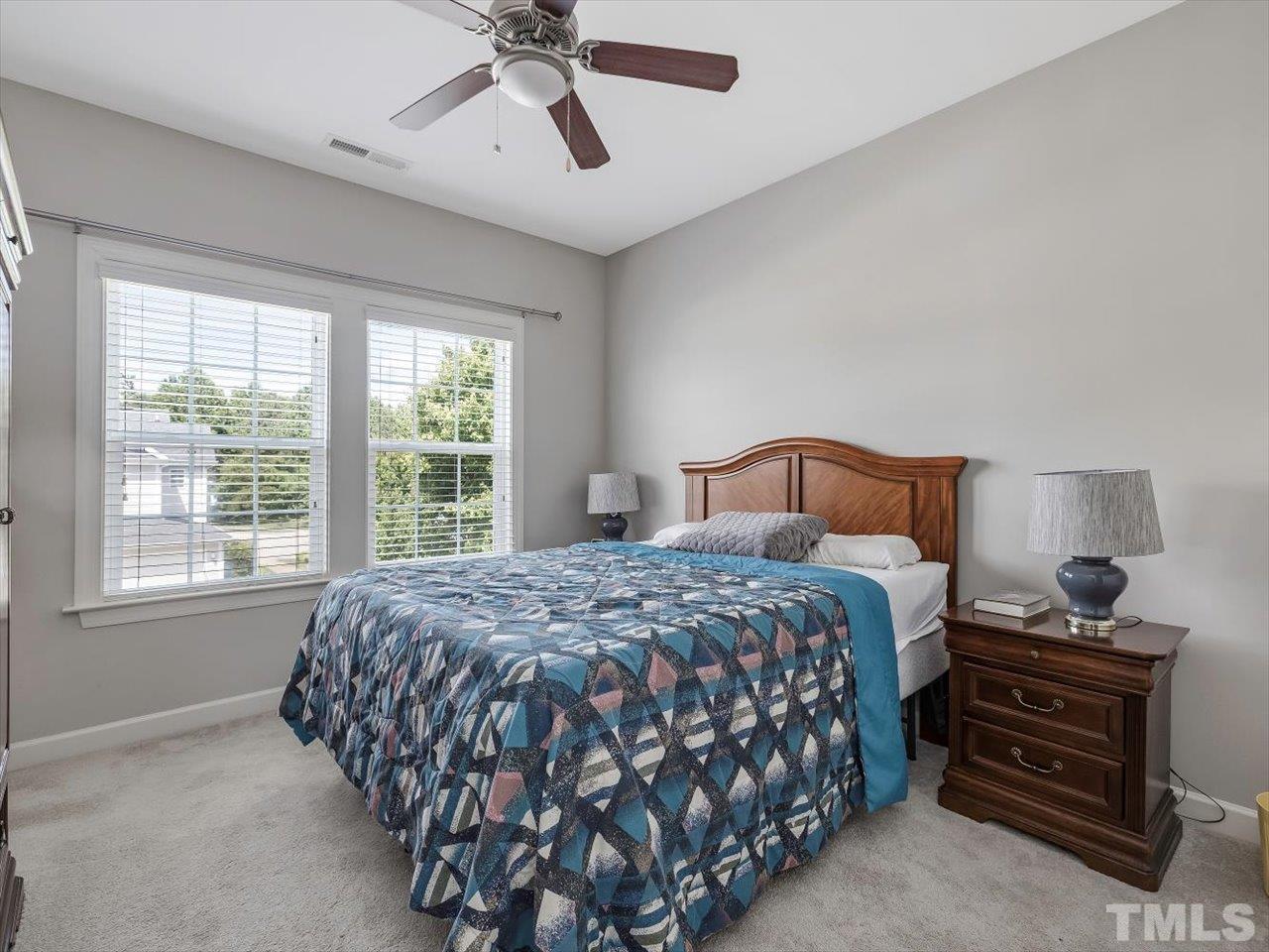 604 Chapanoke Road Raleigh, NC 27603 - Photo 22 of 30 a bedroom with a bed and window