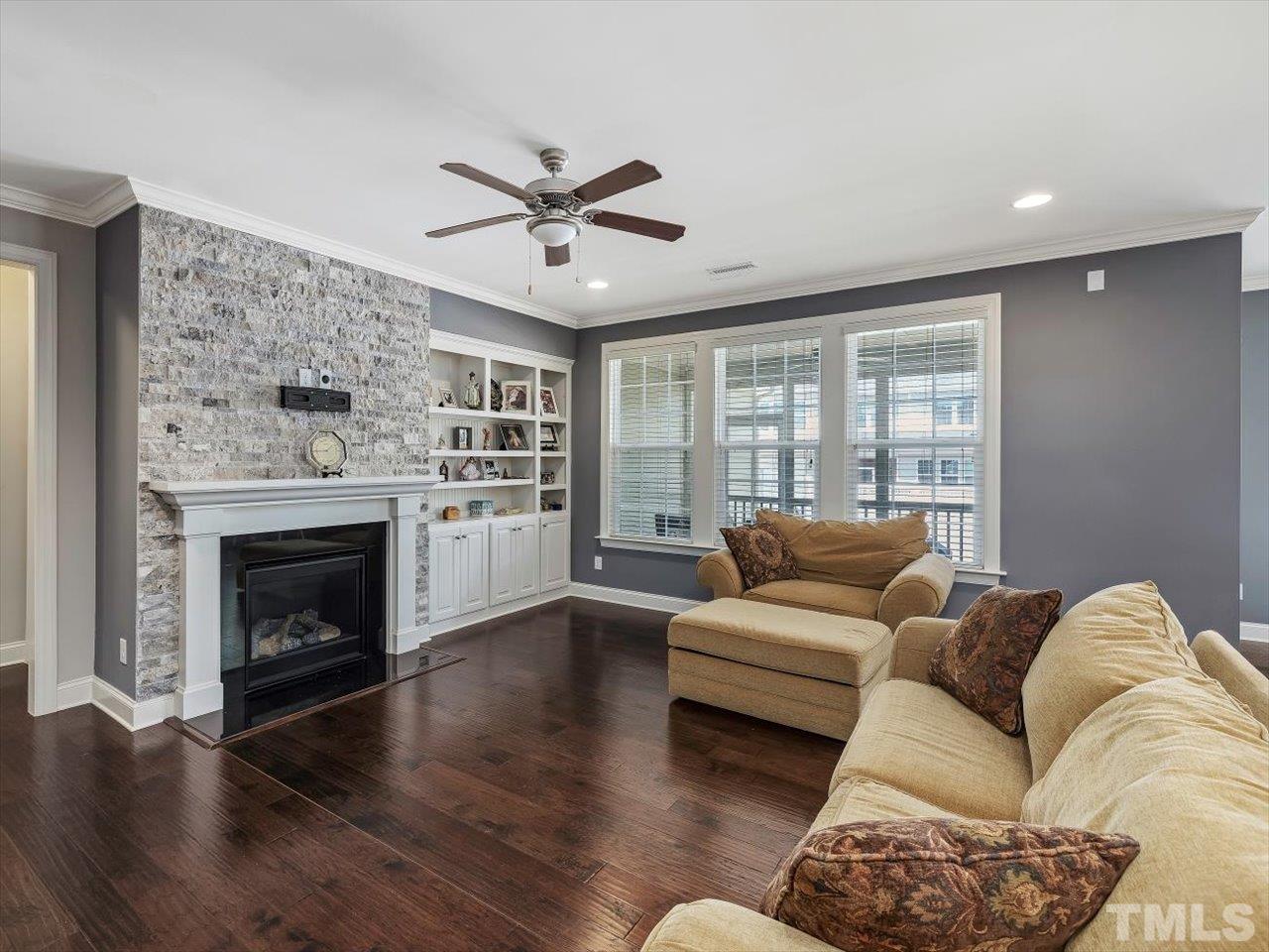 604 Chapanoke Road Raleigh, NC 27603 - Photo 6 of 30 a living room with furniture and a fireplace