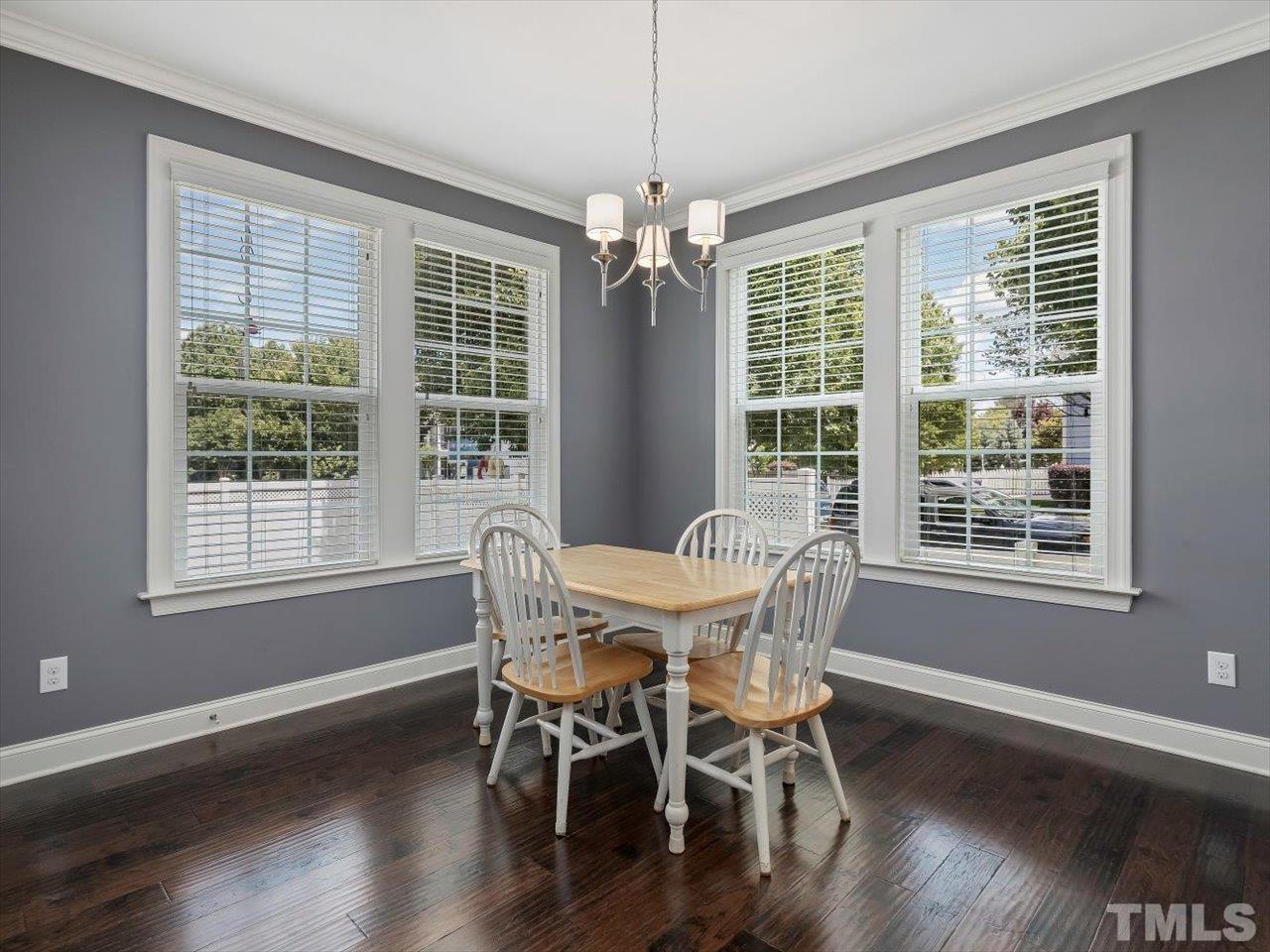 604 Chapanoke Road Raleigh, NC 27603 - Photo 8 of 30 a view of a dining room with furniture window and wooden floor