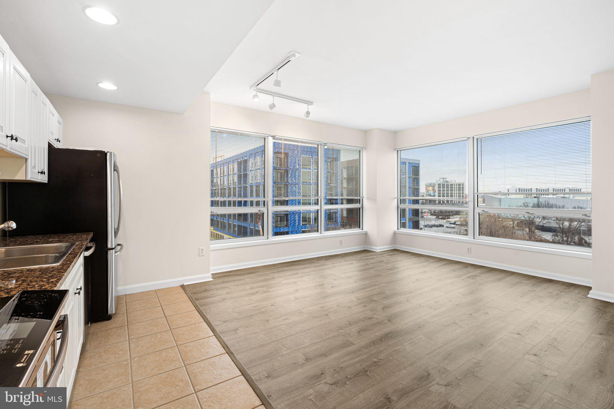 901 North Penn Street, Unit R506 Philadelphia, PA 19123 - Photo 3 of 10 a view of an empty room with a window