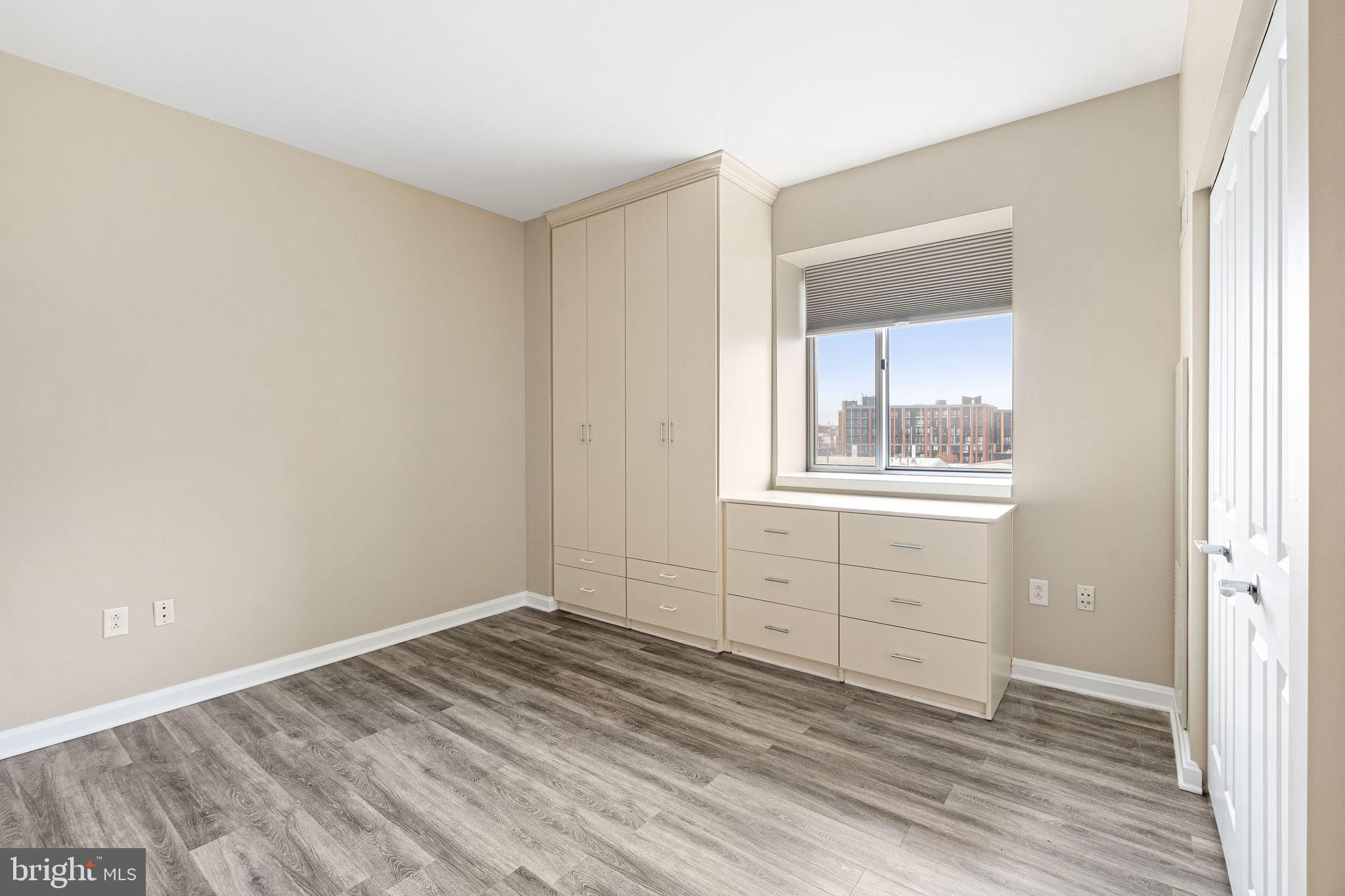 901 North Penn Street, Unit R506 Philadelphia, PA 19123 - Photo 7 of 10 a view of empty room with wooden floor and fan