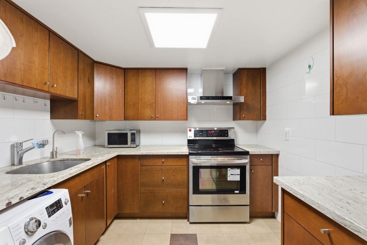 5561 Roundtree Common Fremont, CA 94538 - Photo 6 of 29 a kitchen with stainless steel appliances granite countertop a sink stove and refrigerator