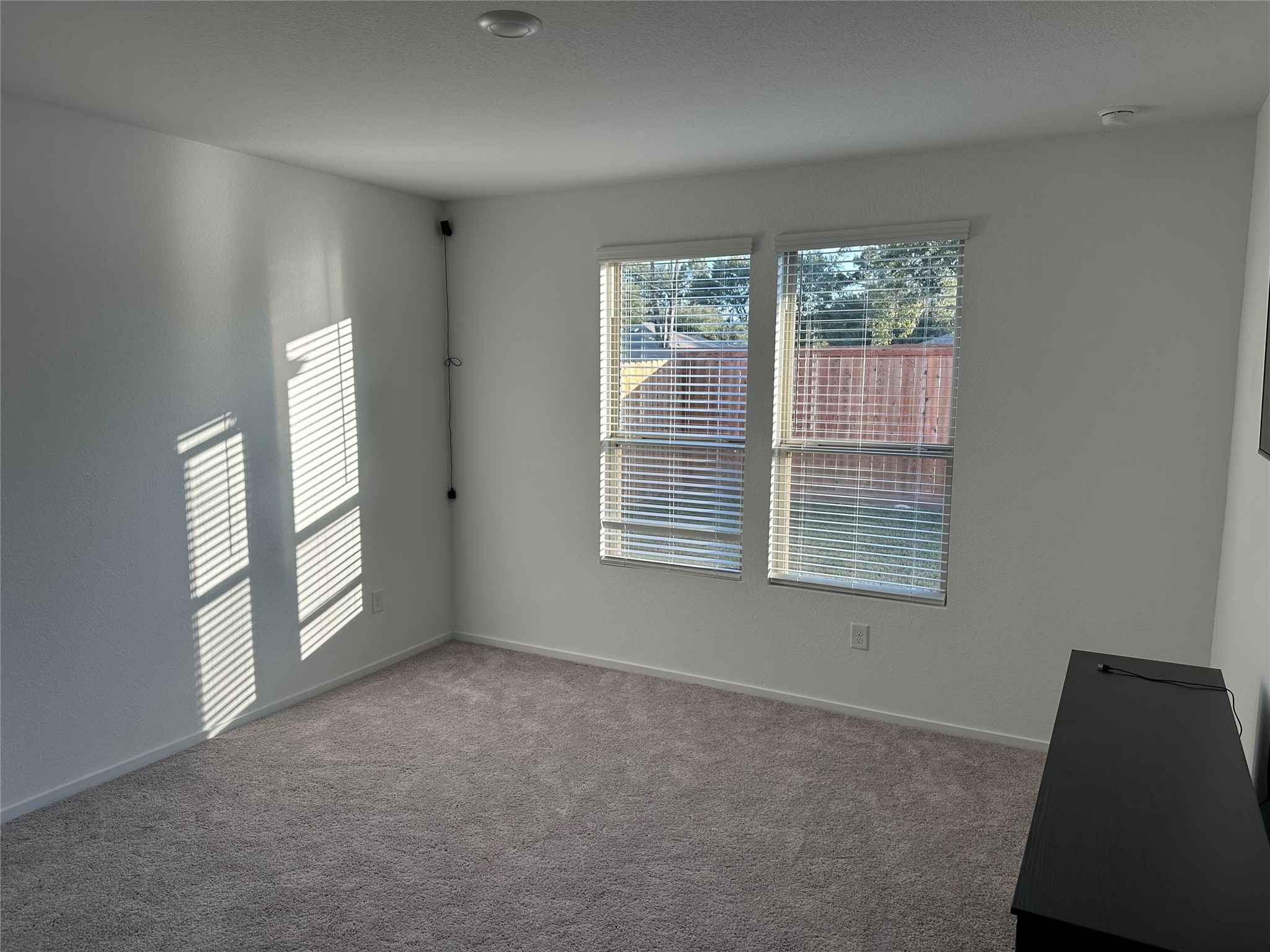 16936 Juniper Blossom Bend Conroe, TX 77302 - Photo 12 of 28 an empty room with windows