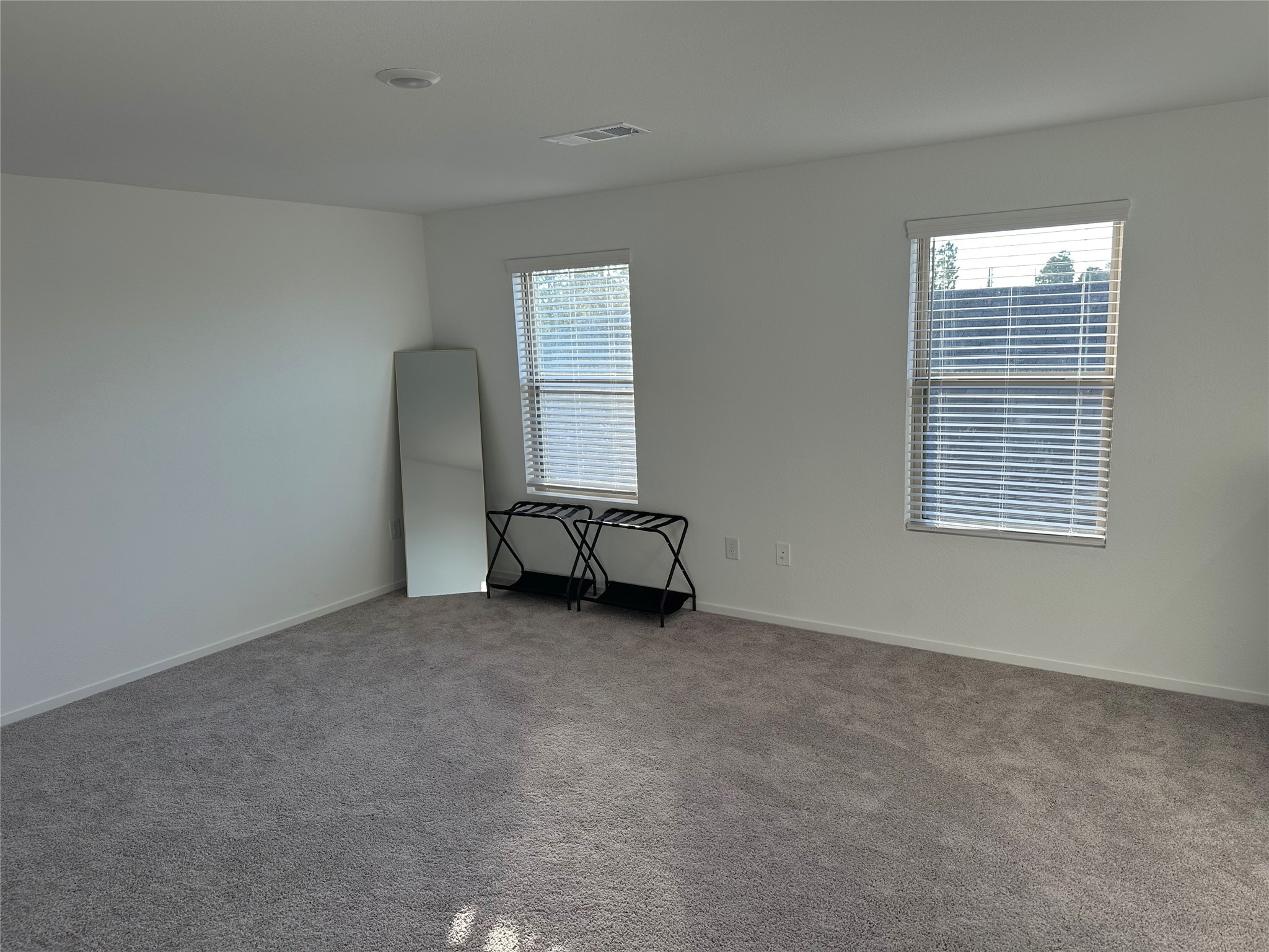 16936 Juniper Blossom Bend Conroe, TX 77302 - Photo 18 of 28 an empty room with windows