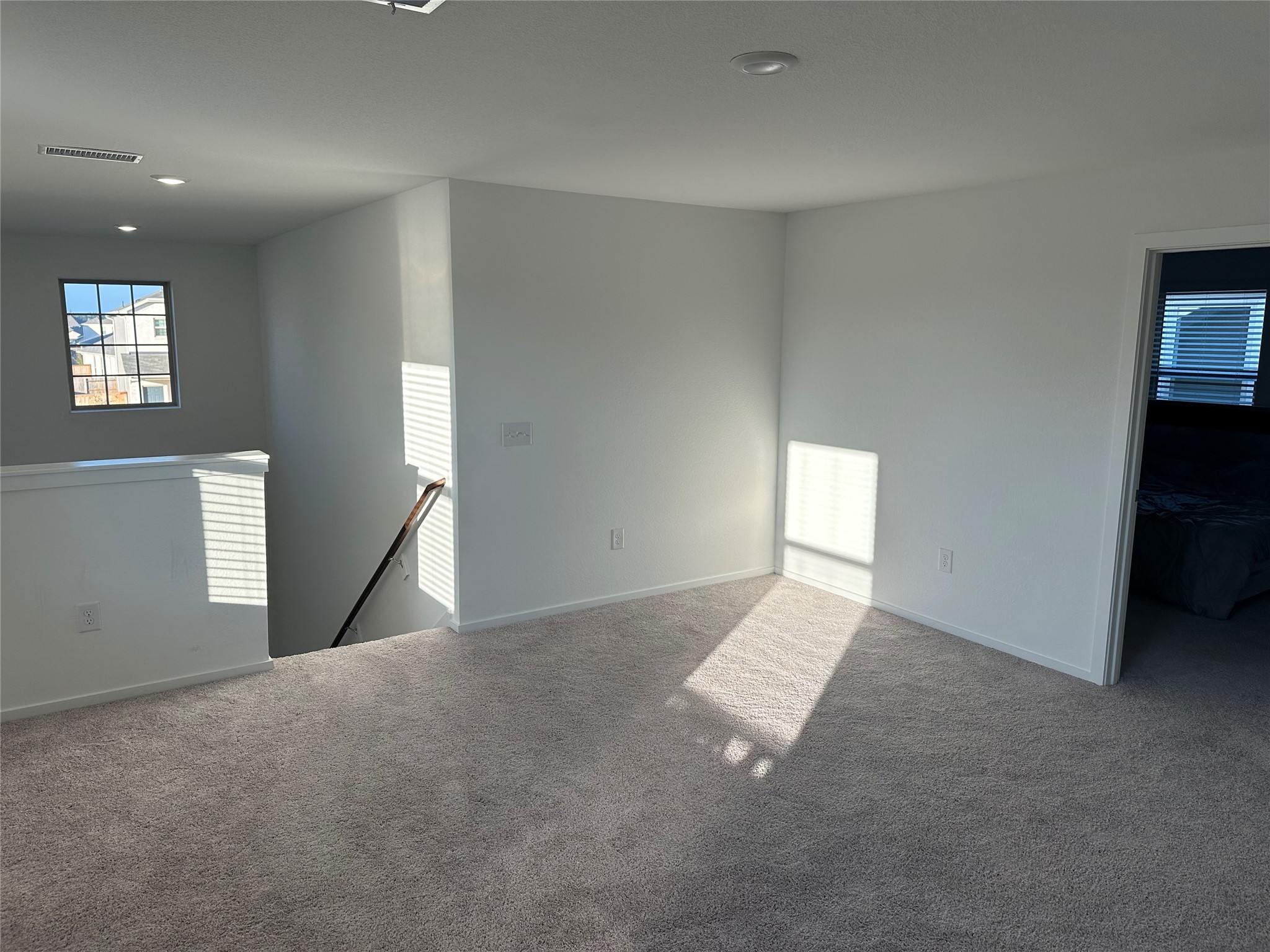 16936 Juniper Blossom Bend Conroe, TX 77302 - Photo 19 of 28 a view of an empty room with a window