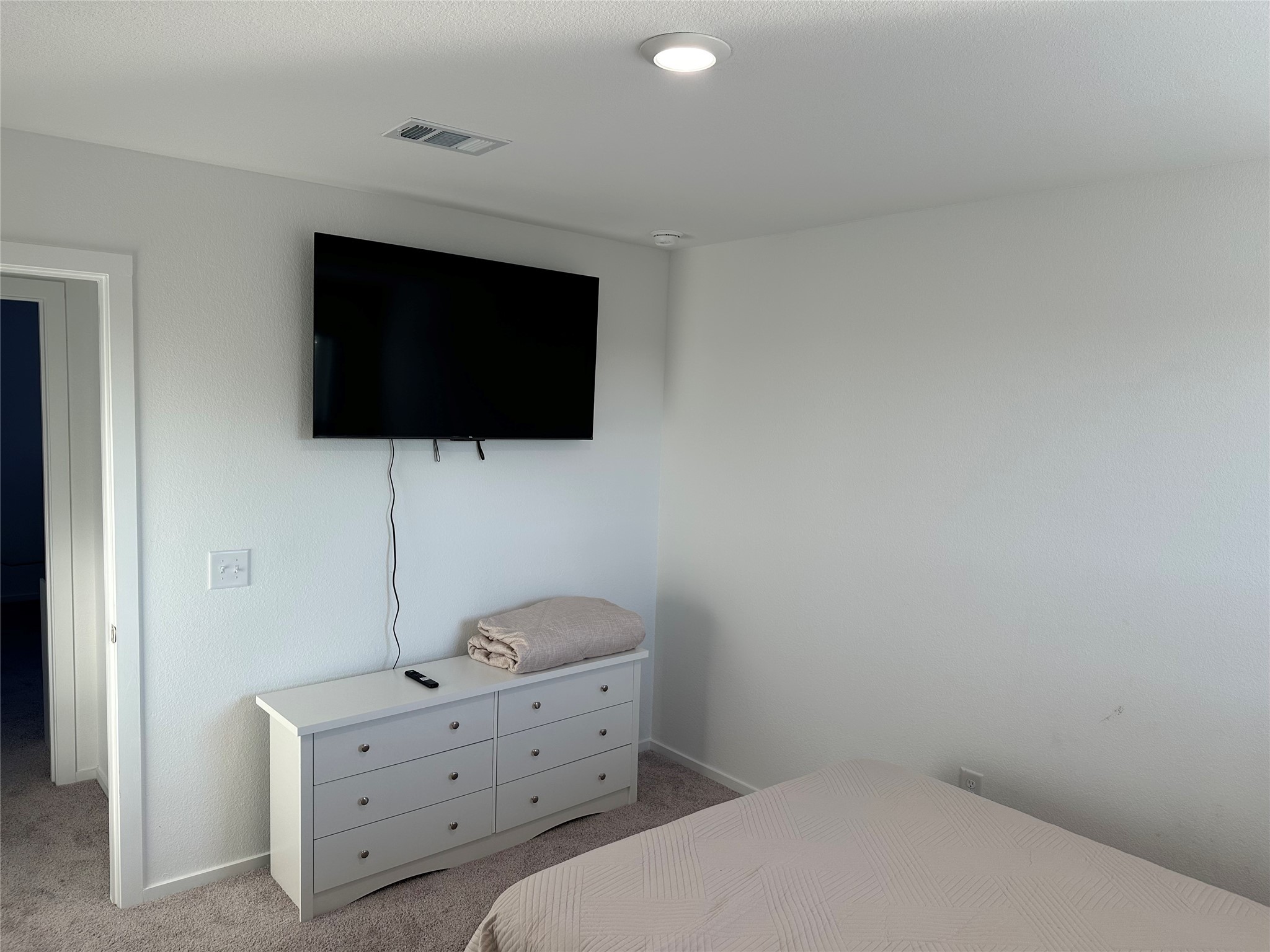 16936 Juniper Blossom Bend Conroe, TX 77302 - Photo 26 of 28 a room with a flat screen tv