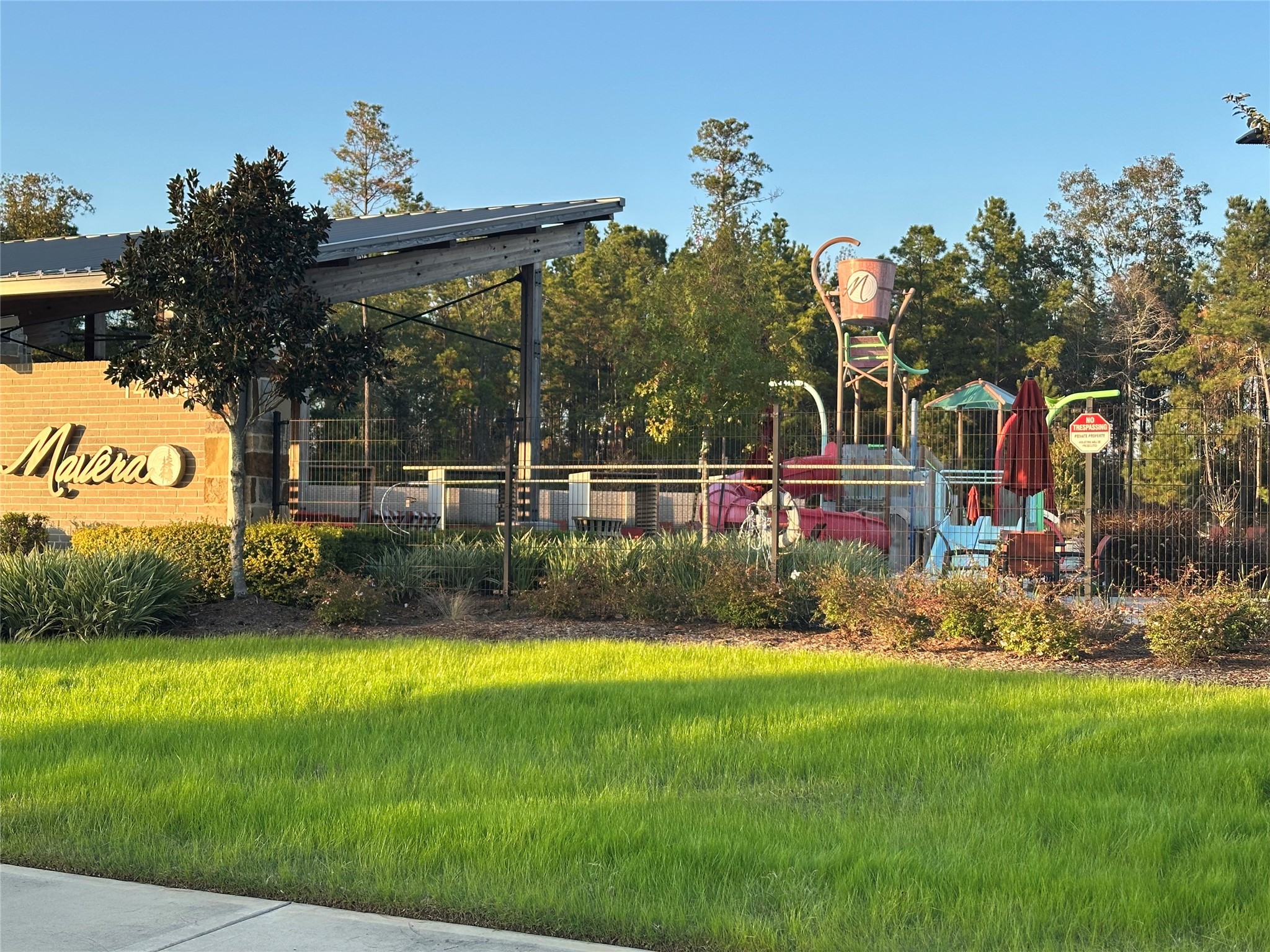 16936 Juniper Blossom Bend Conroe, TX 77302 - Photo 28 of 28 a view of swimming pool with garden and trees