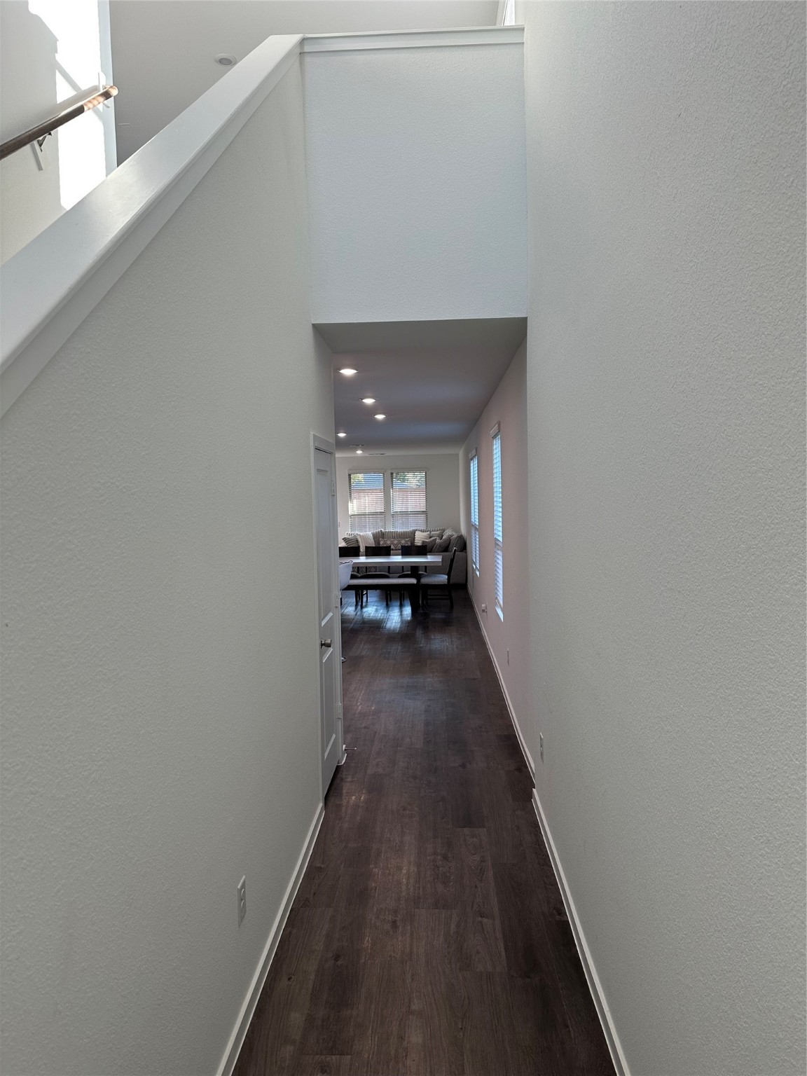 16936 Juniper Blossom Bend Conroe, TX 77302 - Photo 3 of 28 a view of a hallway with wooden floor