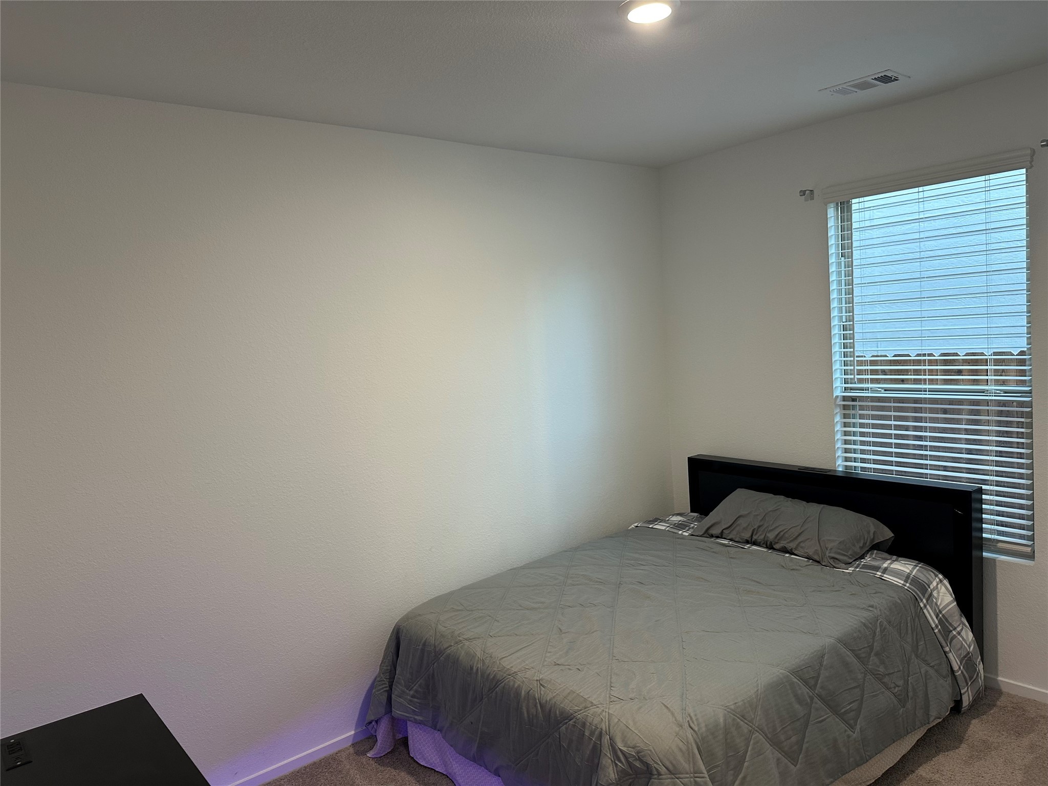 16936 Juniper Blossom Bend Conroe, TX 77302 - Photo 8 of 28 a bedroom with a bed