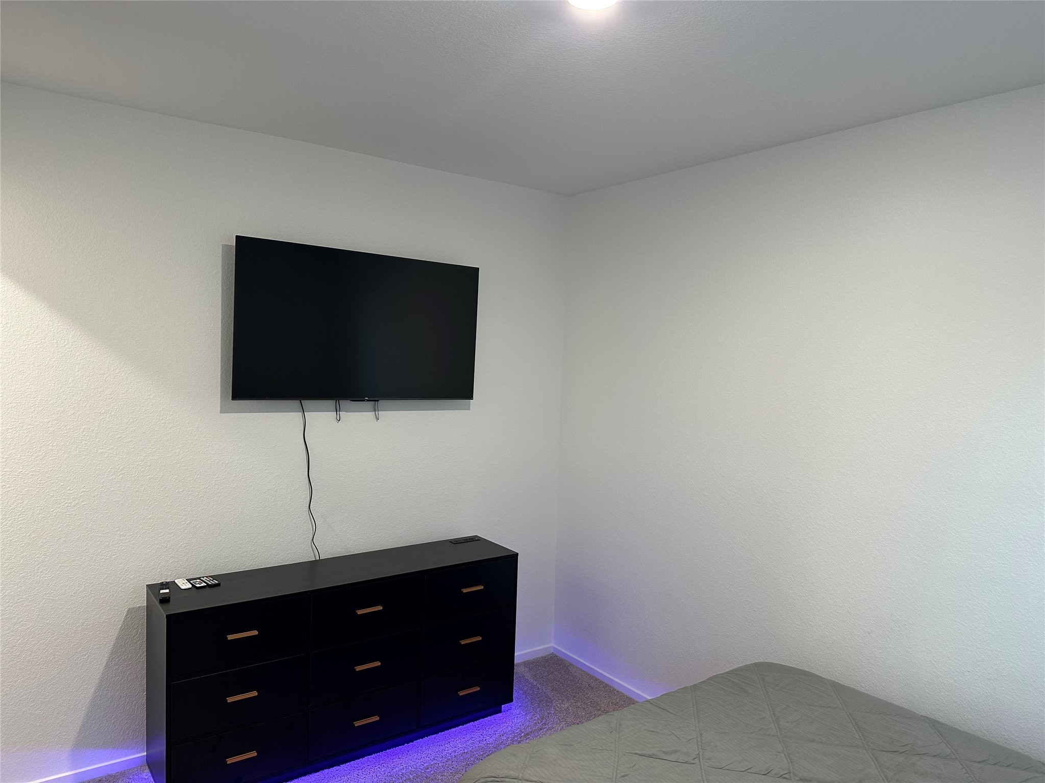 16936 Juniper Blossom Bend Conroe, TX 77302 - Photo 9 of 28 a room with a flat screen tv and a lamp