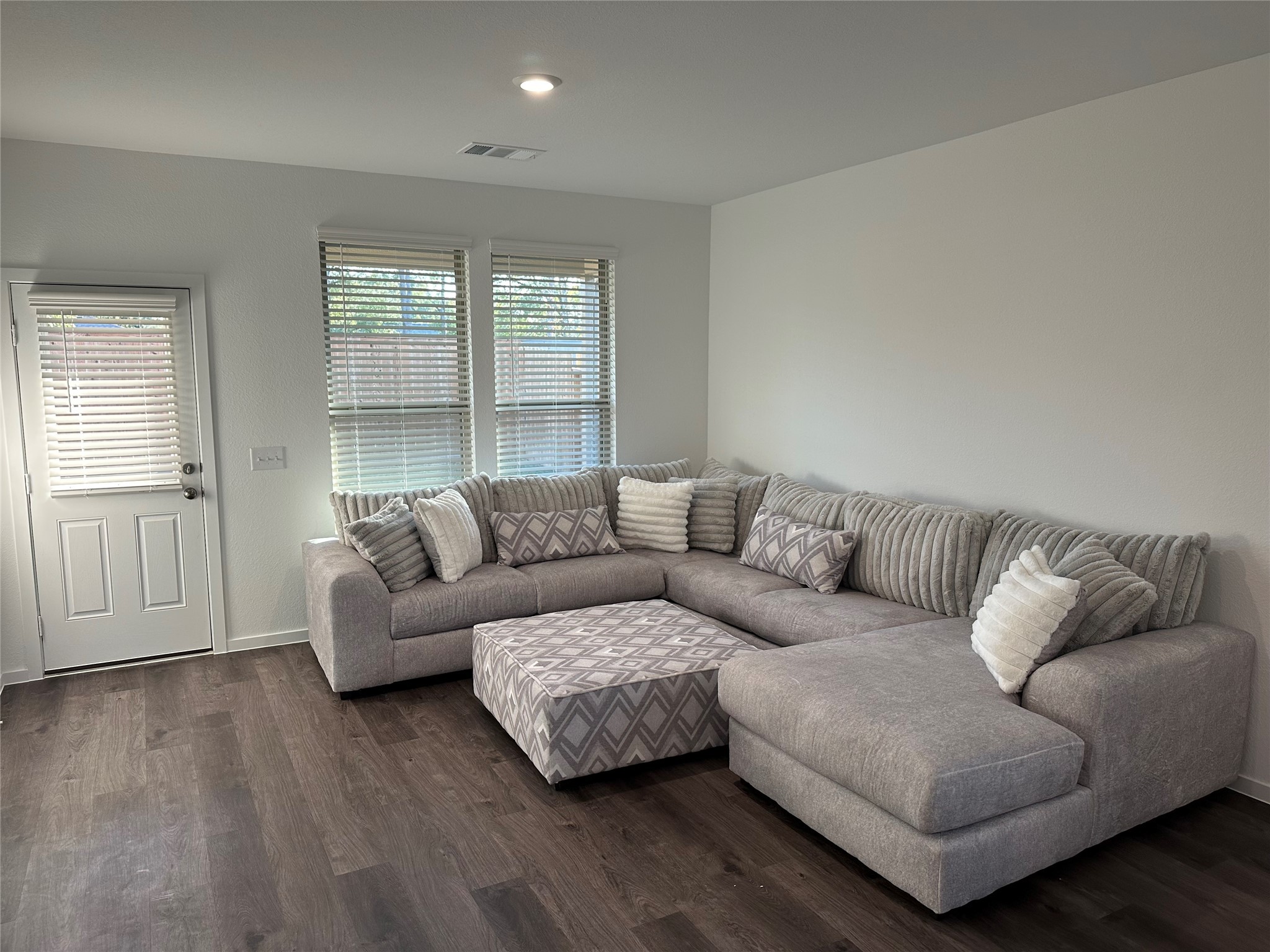 16936 Juniper Blossom Bend Conroe, TX 77302 - Photo 10 of 28 a living room with furniture and a large window