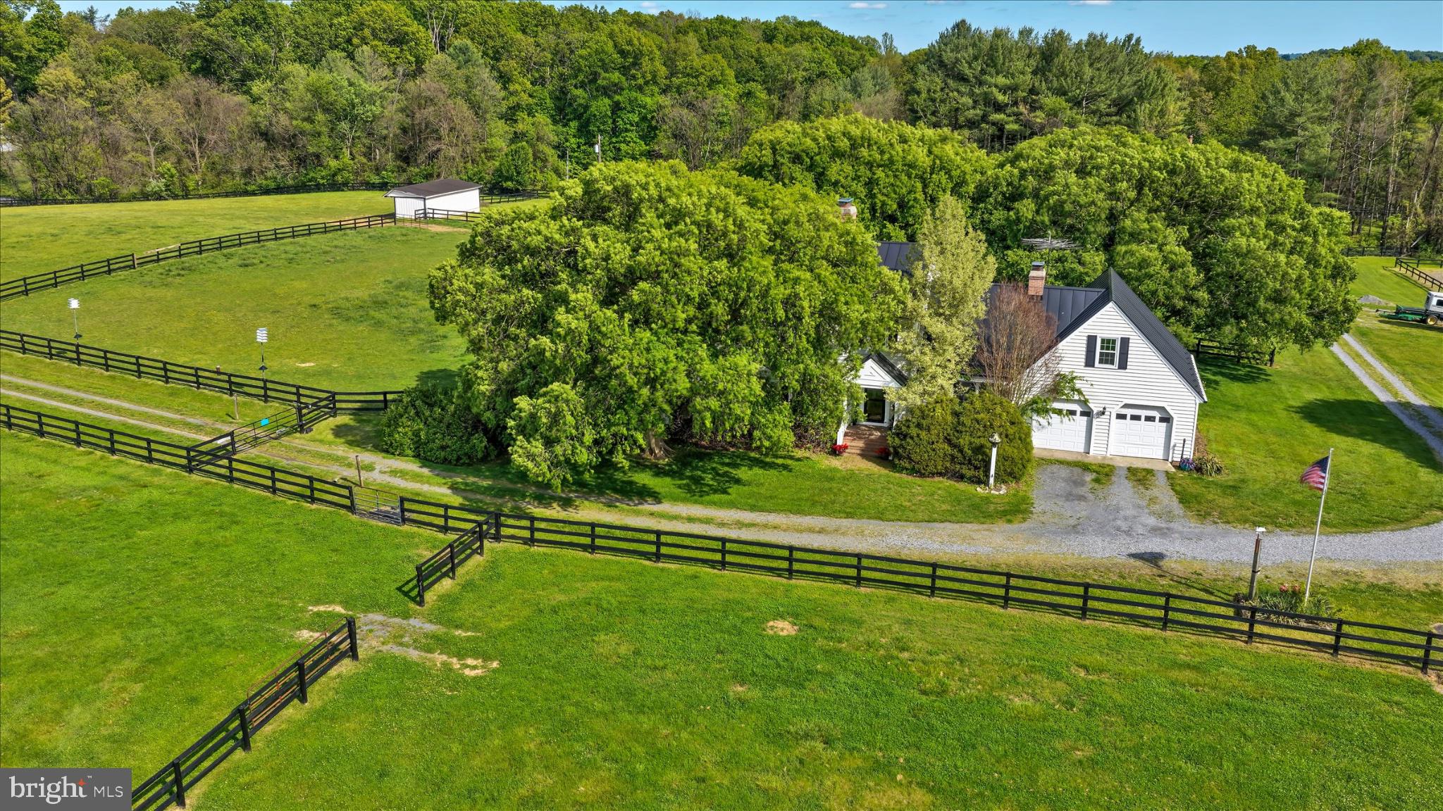 19255 Telegraph Springs Road Purcellville, VA 20132 - Photo 1 of 107 a view of an house with a big yard and potted plants
