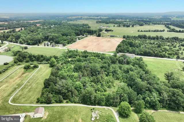 an aerial view of residential house with outdoor space
