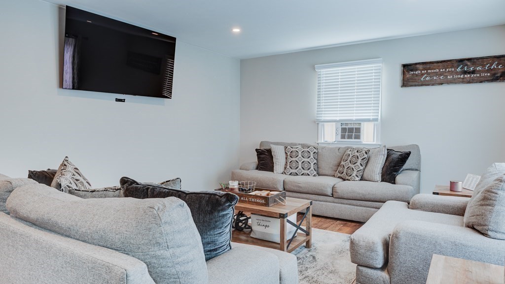 198 Senator Street Springfield, MA 01129 - Photo 4 of 27 a living room with furniture and a flat screen tv