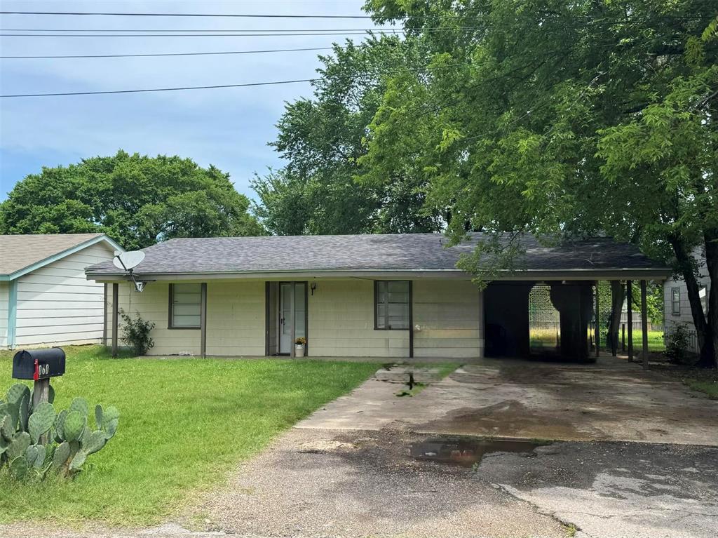 4515 Southeast Loop 286 Paris, TX 75460 - Photo 25 of 37 a front view of a house with a garden