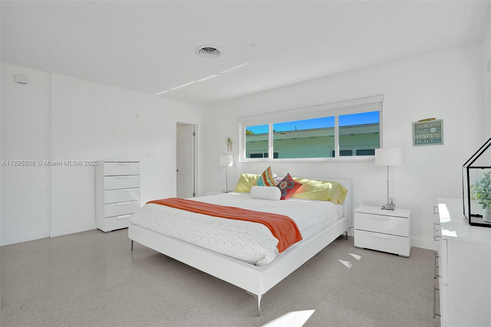 3411 Dover Road Pompano Beach, FL 33062 - Photo 22 of 64 a bedroom with a bed and large window