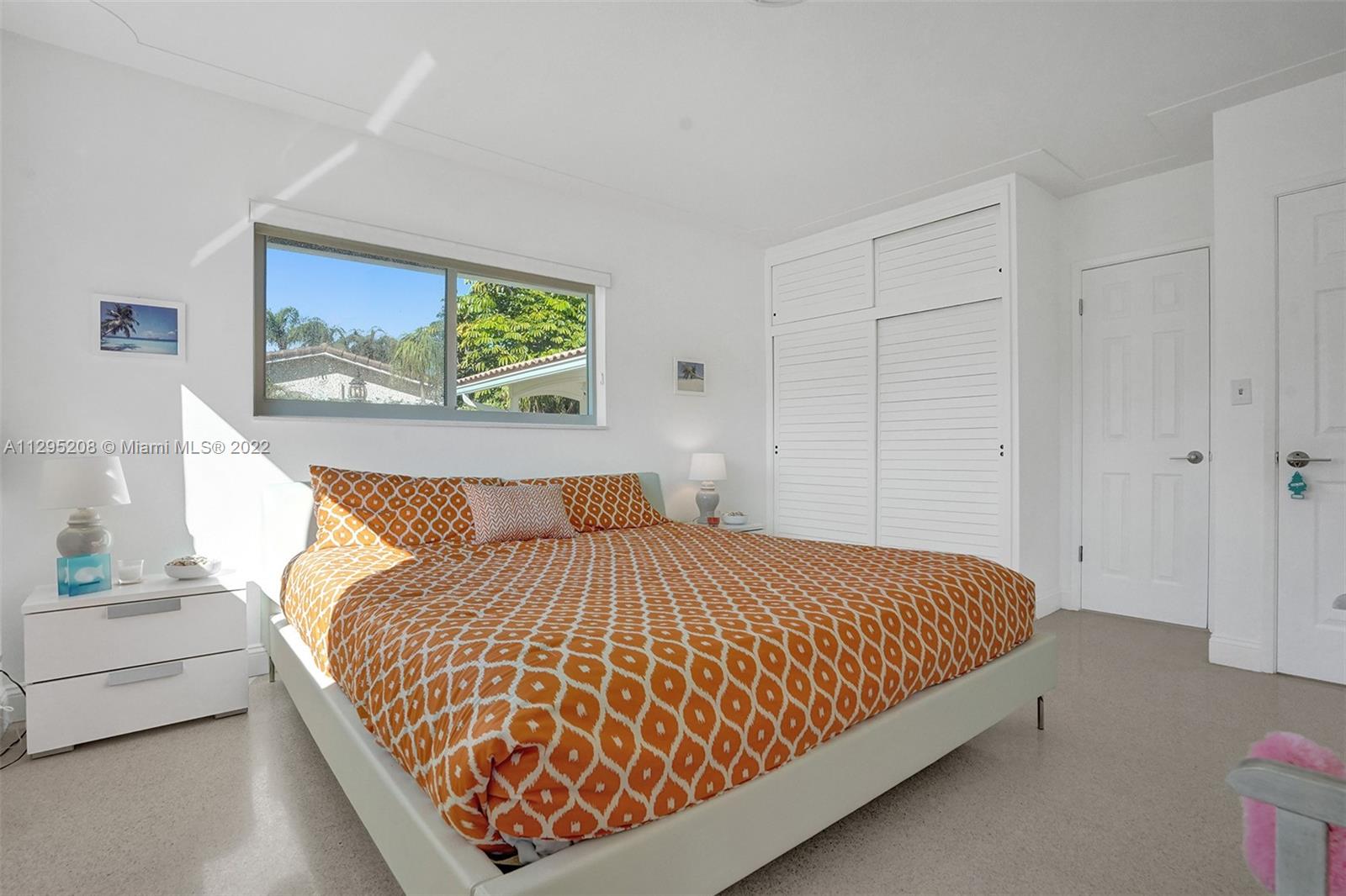 3411 Dover Road Pompano Beach, FL 33062 - Photo 28 of 64 a bedroom with a bed and a painting on the wall