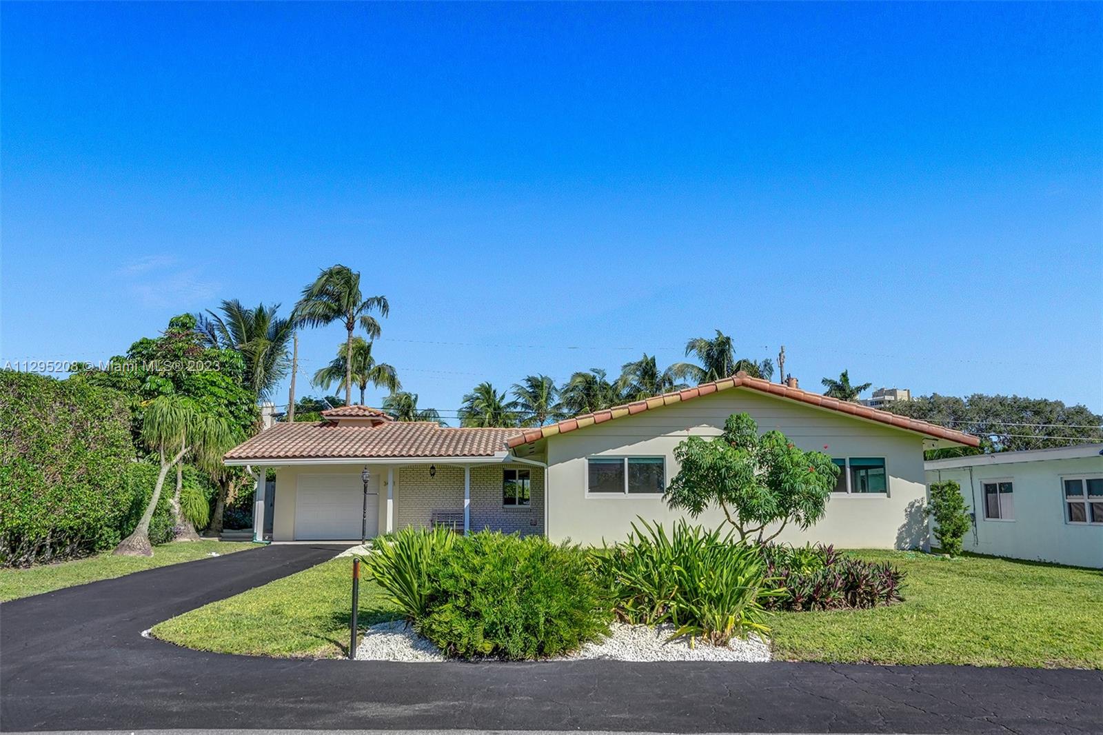3411 Dover Road Pompano Beach, FL 33062 - Photo 31 of 64 front view of a house with a yard