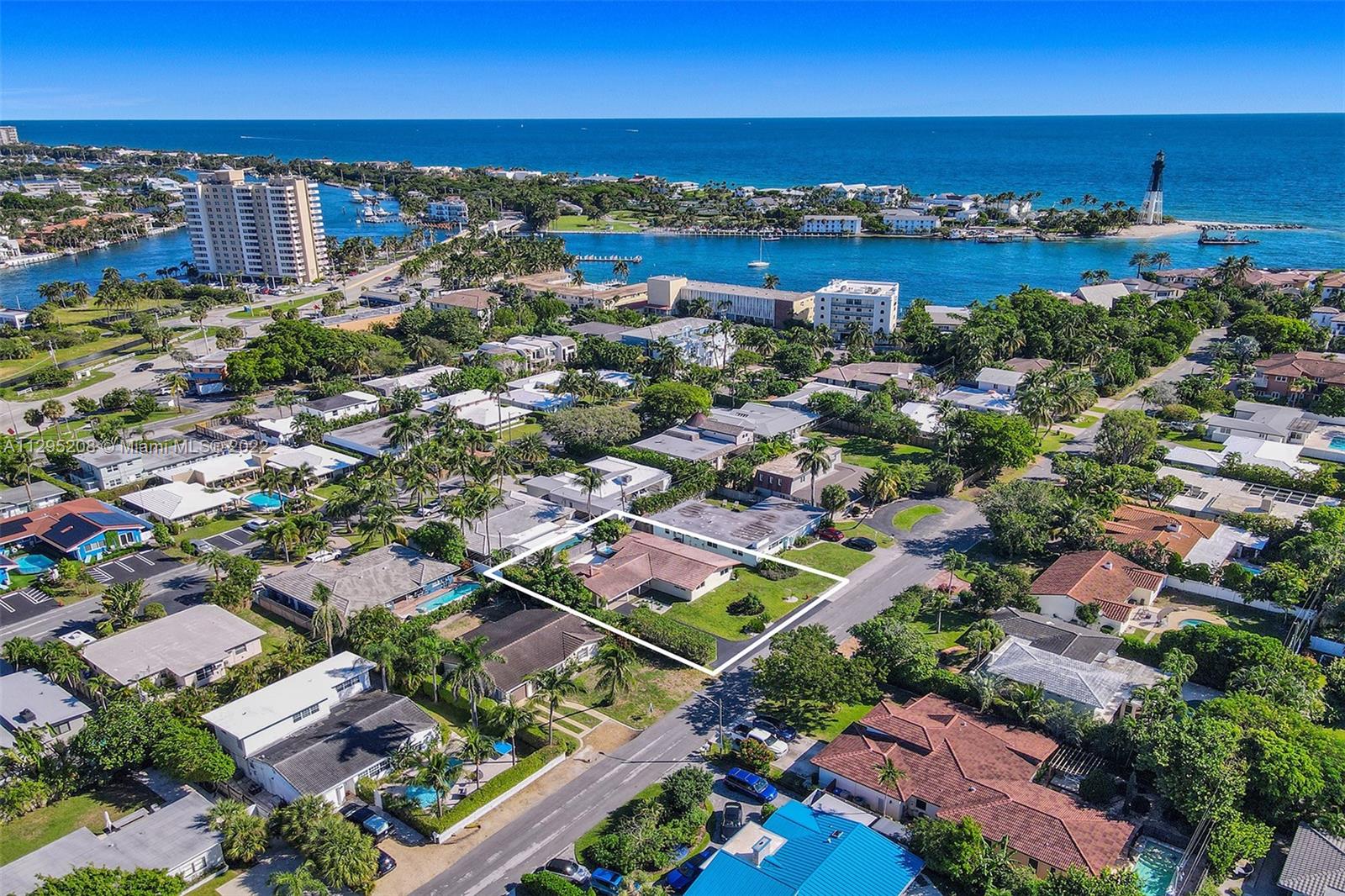 3411 Dover Road Pompano Beach, FL 33062 - Photo 46 of 64 an aerial view of a city with lots of residential buildings ocean and ocean view