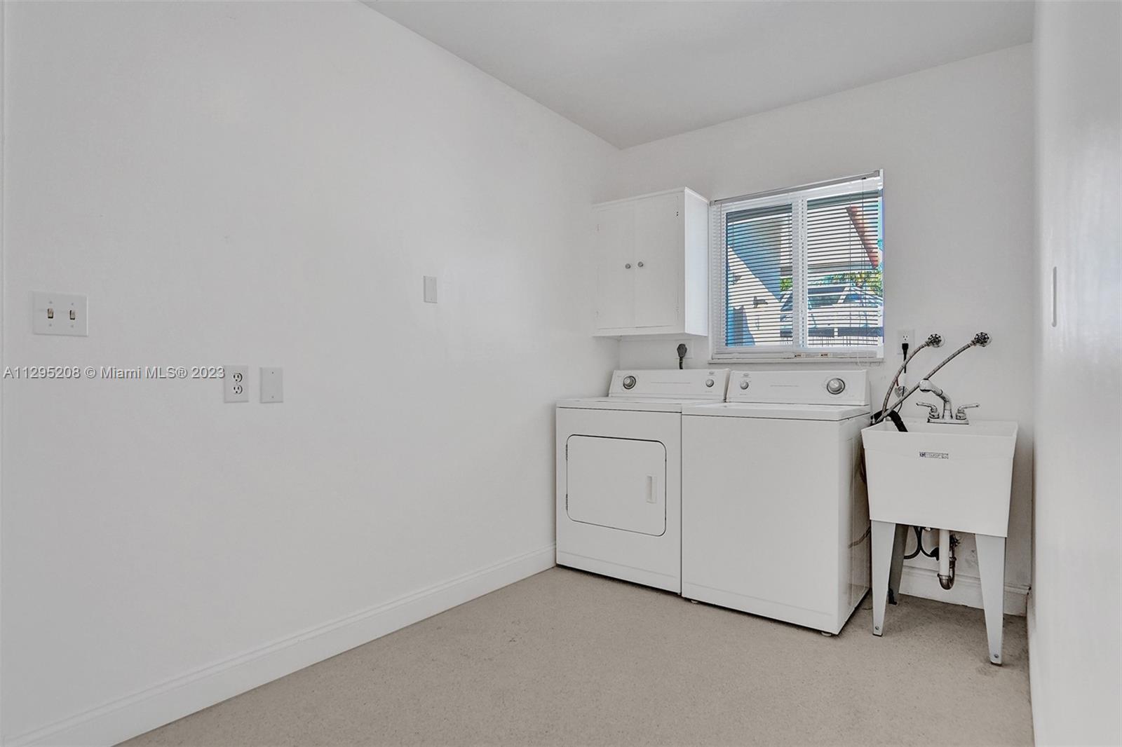 3411 Dover Road Pompano Beach, FL 33062 - Photo 61 of 64 a utility room with dryer and washer