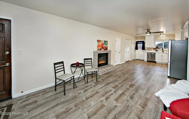 a view of kitchen with furniture and wooden floor
