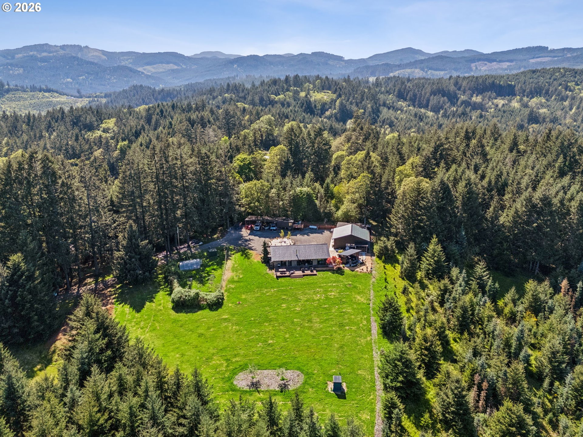 18600 Northwest Meadowlake Road Yamhill, OR 97148 - Photo 43 of 47 a view of a house with a mountain in the background