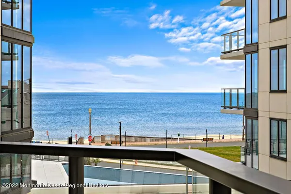 a view of a balcony with an ocean view