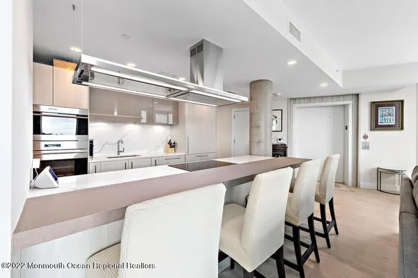 a kitchen with stainless steel appliances sink and cabinets