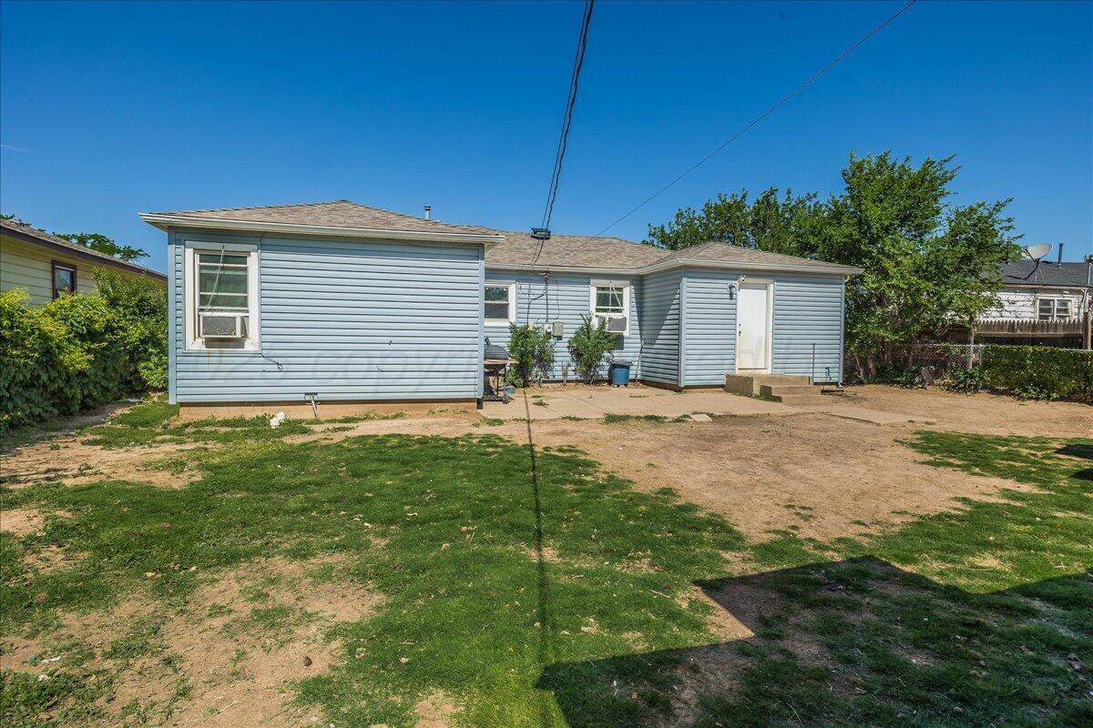 4317 Cline Road Amarillo, TX 79110 - Photo 15 of 18 a backyard of a house with table and chairs