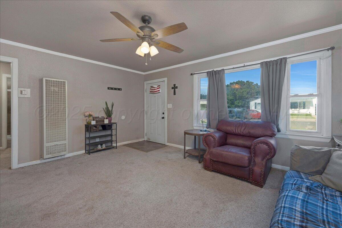 4317 Cline Road Amarillo, TX 79110 - Photo 2 of 18 a living room with furniture and a window