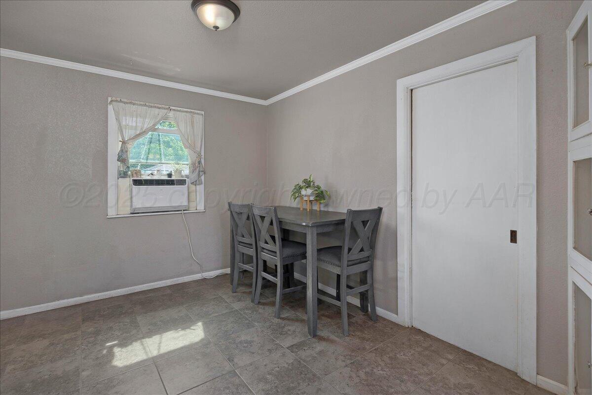 4317 Cline Road Amarillo, TX 79110 - Photo 4 of 18 a dining room with furniture and window