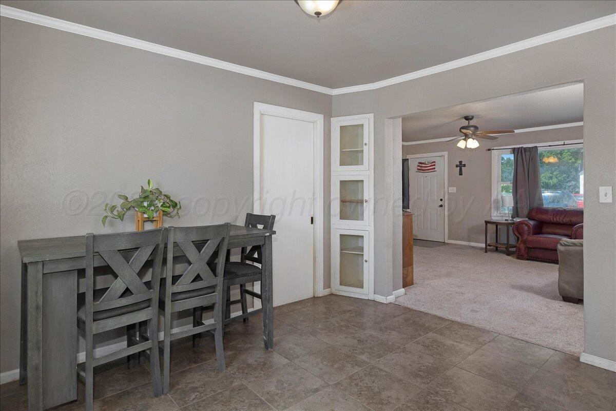4317 Cline Road Amarillo, TX 79110 - Photo 5 of 18 a view of a livingroom with furniture and a flat screen tv