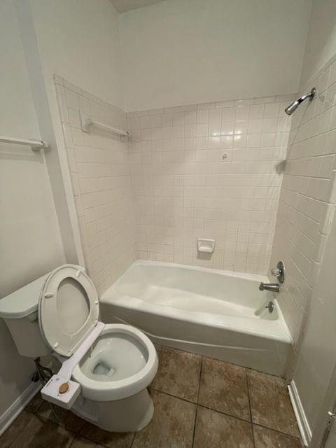 2529 Rio Grande Street, Unit 64 Austin, TX 78705 - Photo 9 of 9 Bathroom featuring shower combination and tile patterned flooring