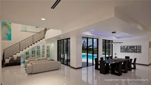 a living room with furniture and large windows