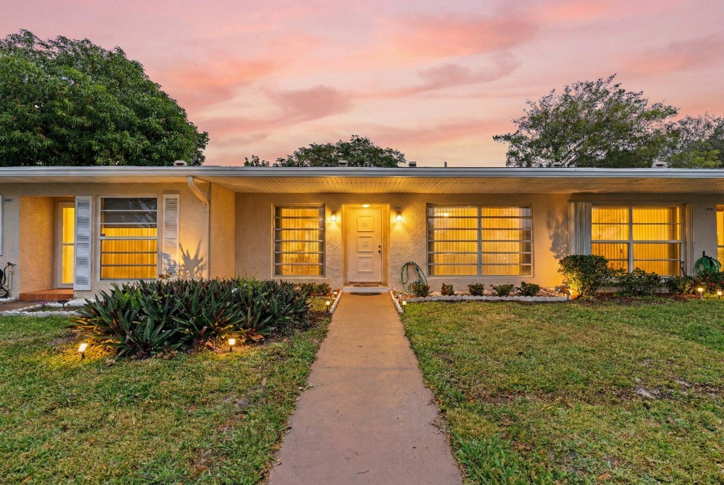 8555 Bella Vista Drive, Unit 86 Boca Raton, FL 33433 - Photo 1 of 48 a view of a house with backyard and garden