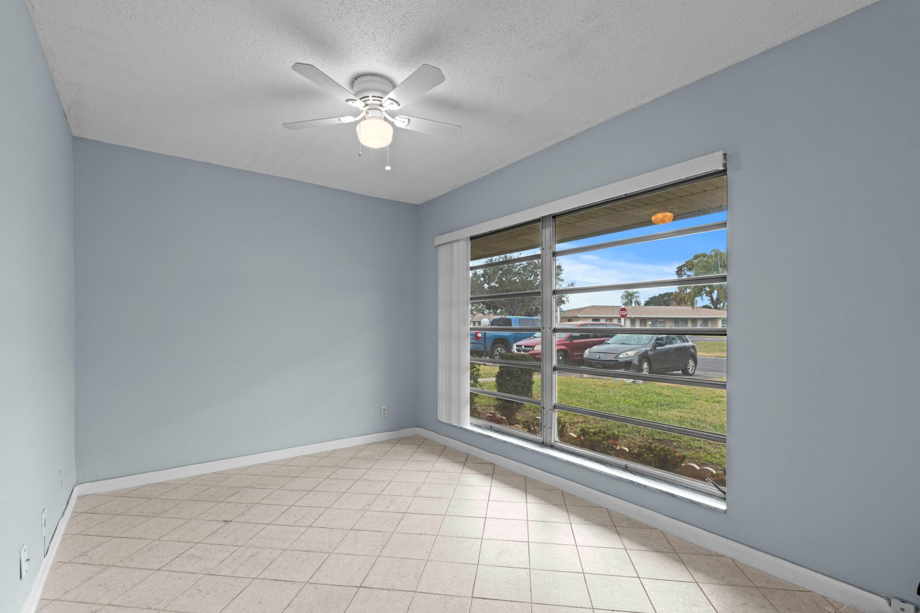 8555 Bella Vista Drive, Unit 86 Boca Raton, FL 33433 - Photo 13 of 48 a view of an empty room with a window