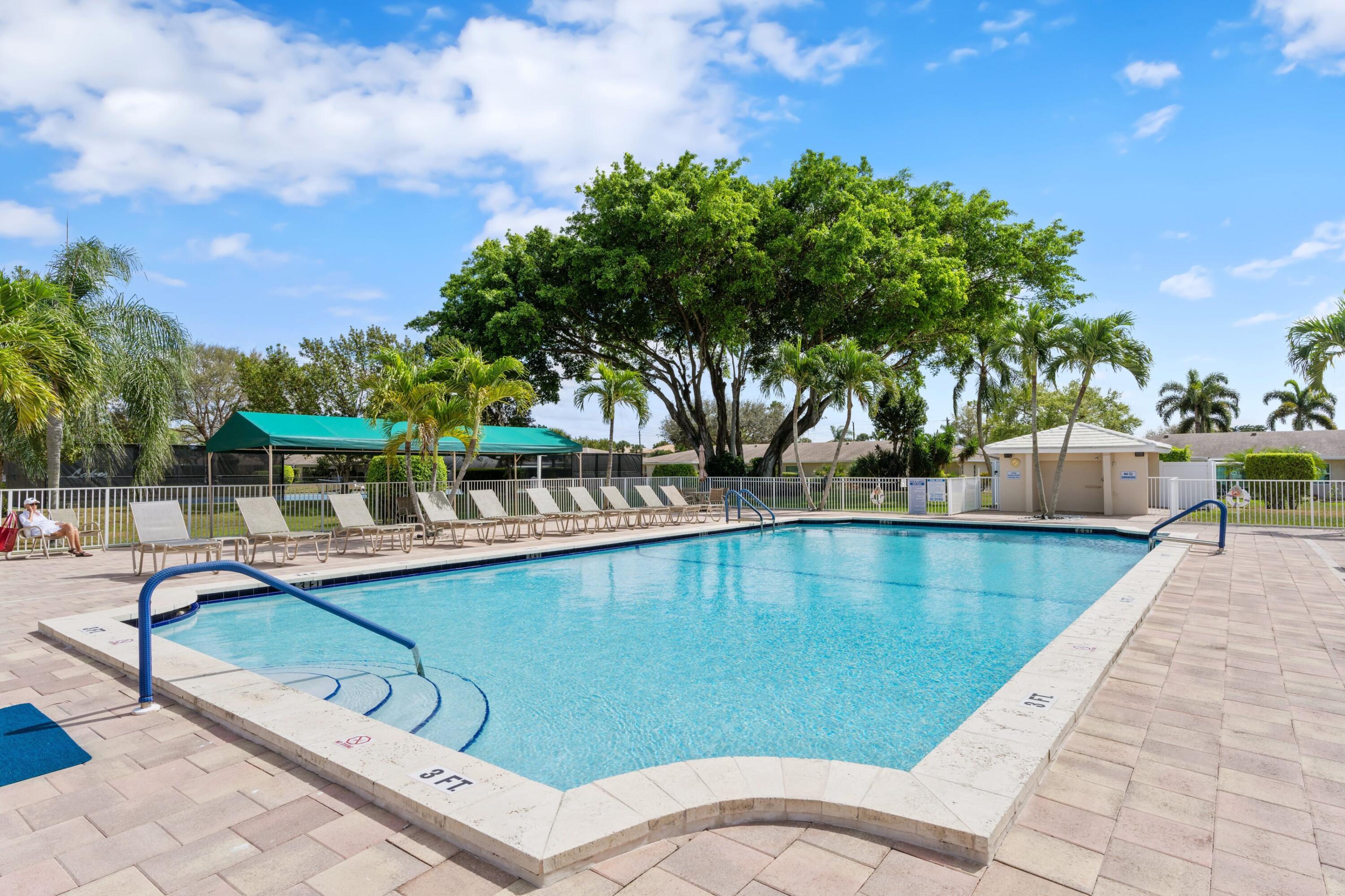 8555 Bella Vista Drive, Unit 86 Boca Raton, FL 33433 - Photo 19 of 48 a view of a swimming pool with a patio